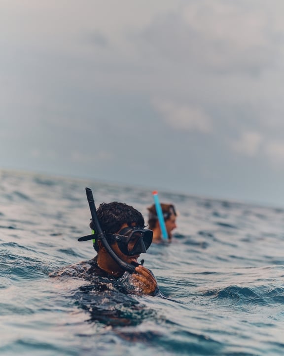 Photo by One&Only Reethi Rah on May 28, 2026. May be an image of swimming, snorkel, glasses, wetsuit, body of water and text.