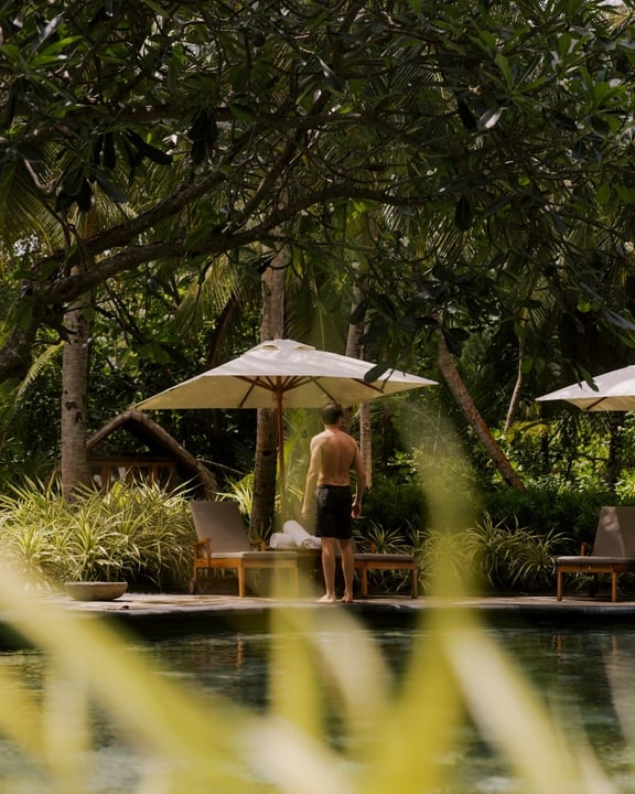 Photo by One&Only Reethi Rah on August 10, 2026. May be an image of deck chair, umbrella, chaise longue, pool, outdoors, cabana and text.