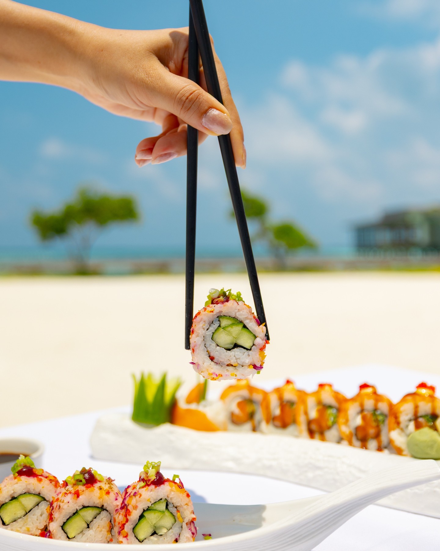 Photo shared by OZEN LIFE MAADHOO on June 15, 2026 tagging @maadhoomaldives. May be an image of sushi, chopsticks, platter, buffet and text.