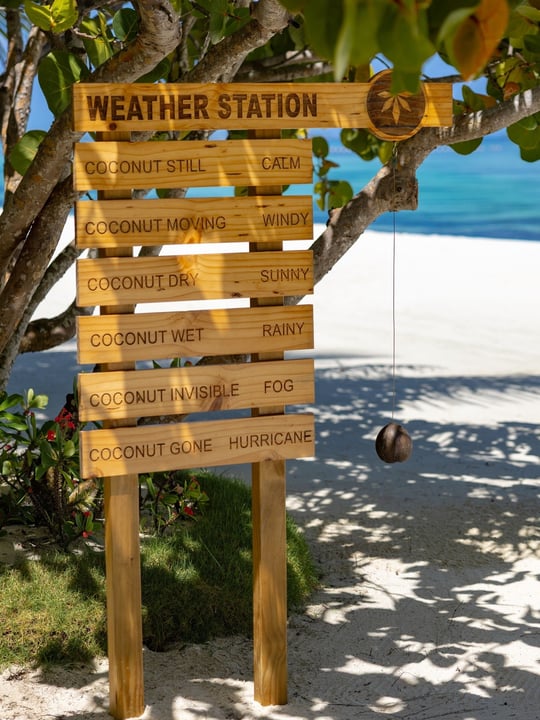 Photo by OZEN LIFE MAADHOO in OZEN LIFE Maadhoo. May be an image of towel rack, bird feeder, deck chair, umbrella, rack and text that says "WEATHER STATION COCONUTSTILL STILL CALM COCONUT.MOVING_WINDY