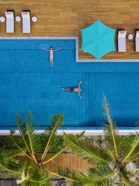 Photo by Pullman Maldives Maamutaa on June 13, 2026. May be an image of umbrella, deck chair, chaise longue, pool, outdoors, cabana and text.
