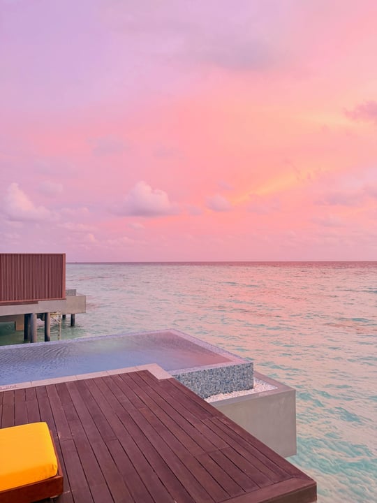 Photo by Pullman Maldives Maamutaa on June 18, 2026. May be an image of twilight, horizon, cabana and text.