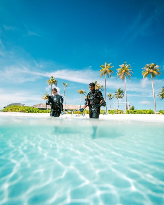 Photo shared by Radisson Blu Resort Maldives on August 12, 2026 tagging @radissonblu, and @radissonhotels. May be an image of swimming, umbrella, pool, palm trees, cabana and text.