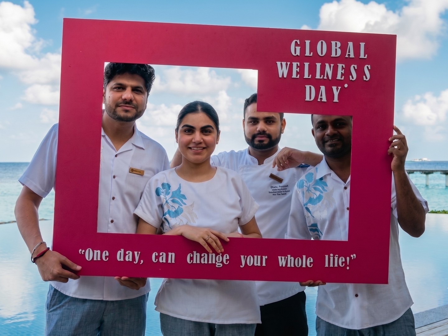 Photo by NH Collection Maldives Reethi Resort on June 15, 2026. May be an image of one or more people, people smiling, people standing, poster, office and text that says "GLOBAL WELLNESS DAY မသ်သမ် "O