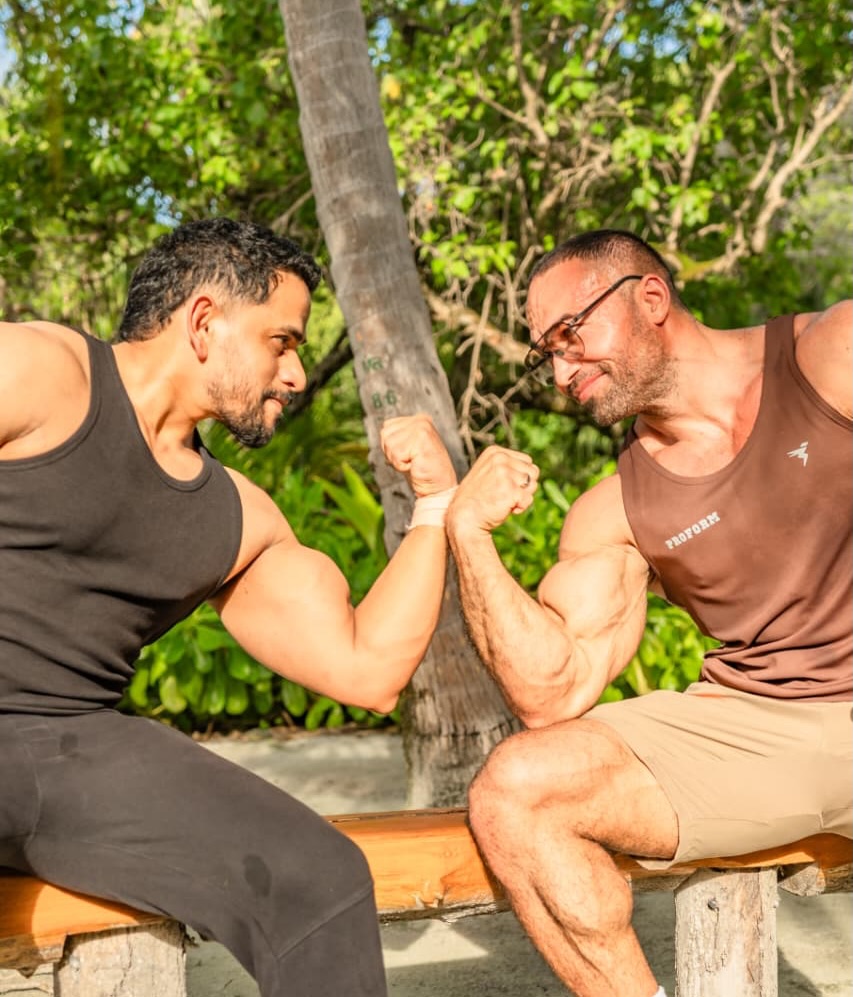 Photo shared by Sheraton Maldives Full Moon Resort & Spa on June 14, 2026 tagging @timursabirovr, @globalwellnessday, and @mesmerizingmaldivesphoto. May be an image of one or more people, beard, bicep