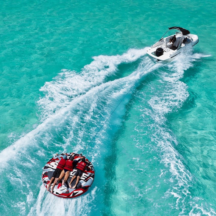 Photo shared by Six Senses Kanuhura on July 31, 2026 tagging @oceanmaldives. May be an image of parasail, jet ski, raft, speedboat and text.