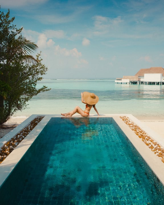 Photo by Six Senses Kanuhura on August 08, 2026. May be an image of swimming, chaise longue, pool, cabana and text.