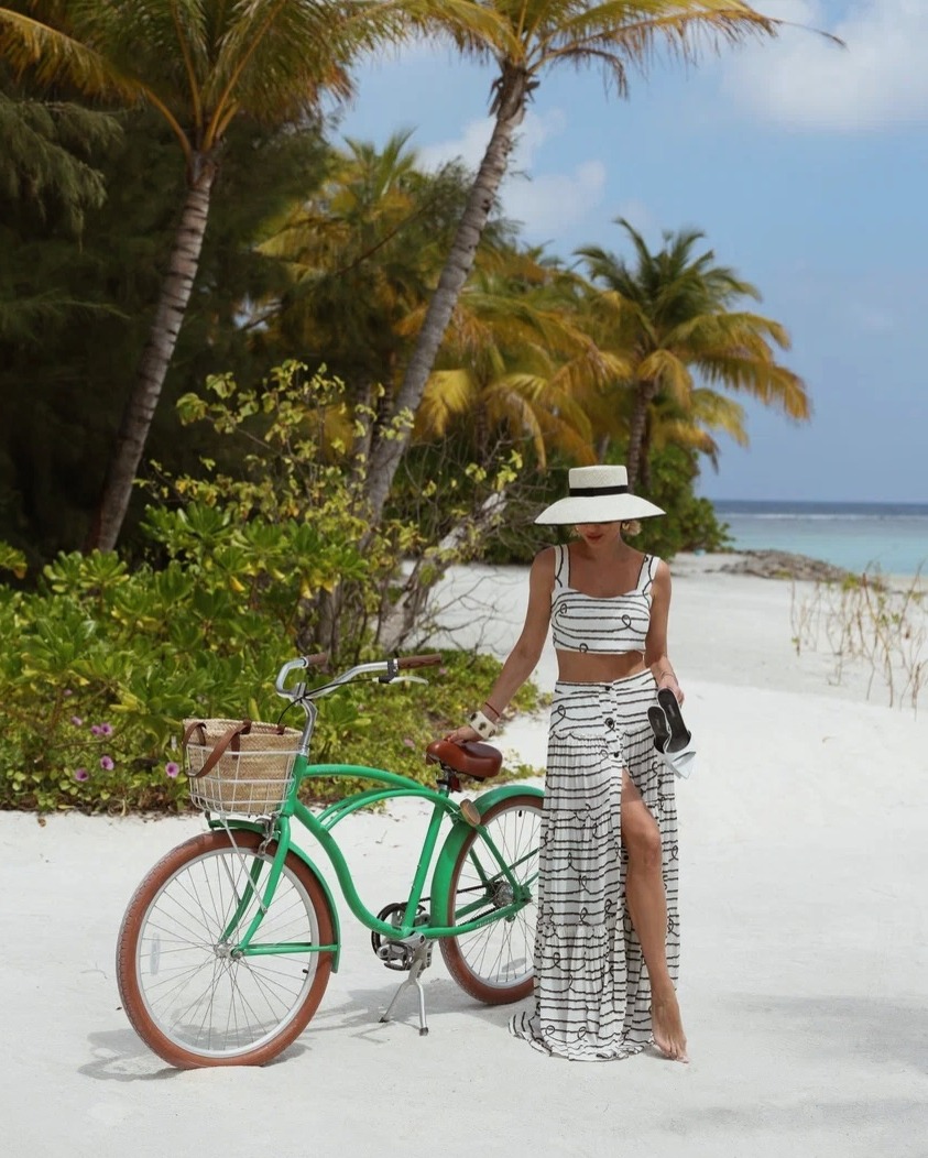 Photo by SO/ Maldives on June 15, 2026. May be an image of bicycle, towel, sarong, scooter, headscarf and text.