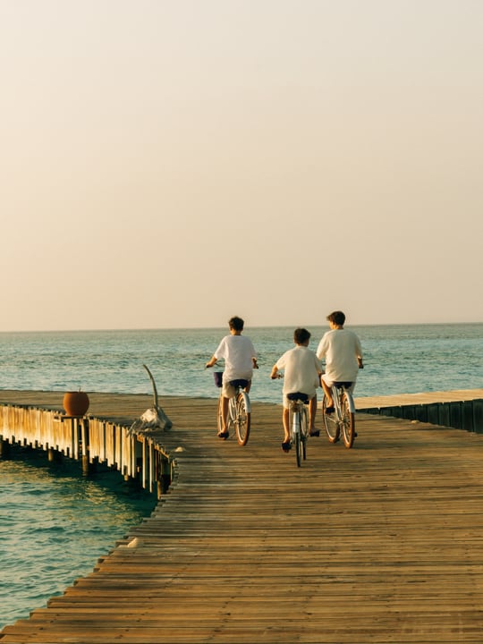 Photo by Soneva in Soneva Jani. May be an image of one or more people, bicycle, outdoors and text.