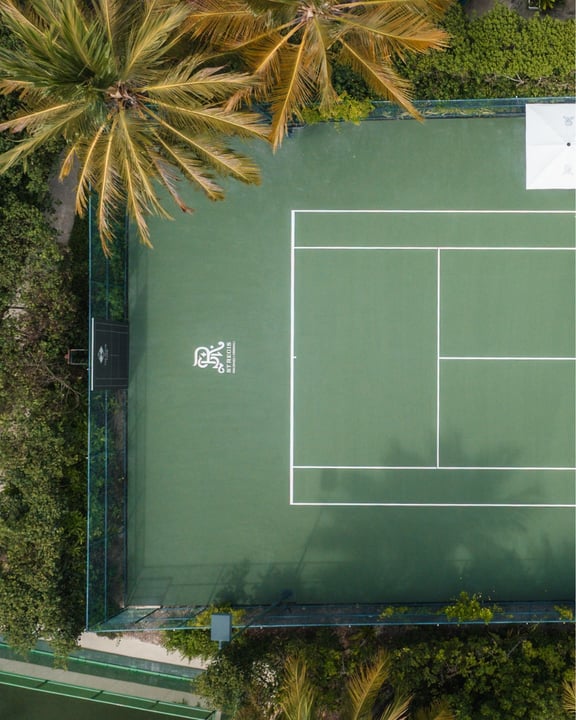 Photo by St. Regis Hotels & Resorts on August 06, 2026. May be an image of tennis player, racket and text.