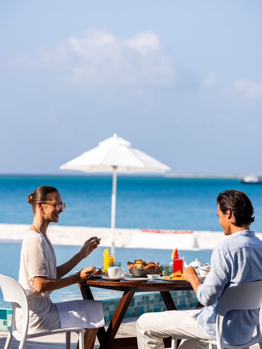 Photo by The Standard, Maldives in The Standard, Maldives. May be an image of one or more people, umbrella, cabana, outdoors and text.