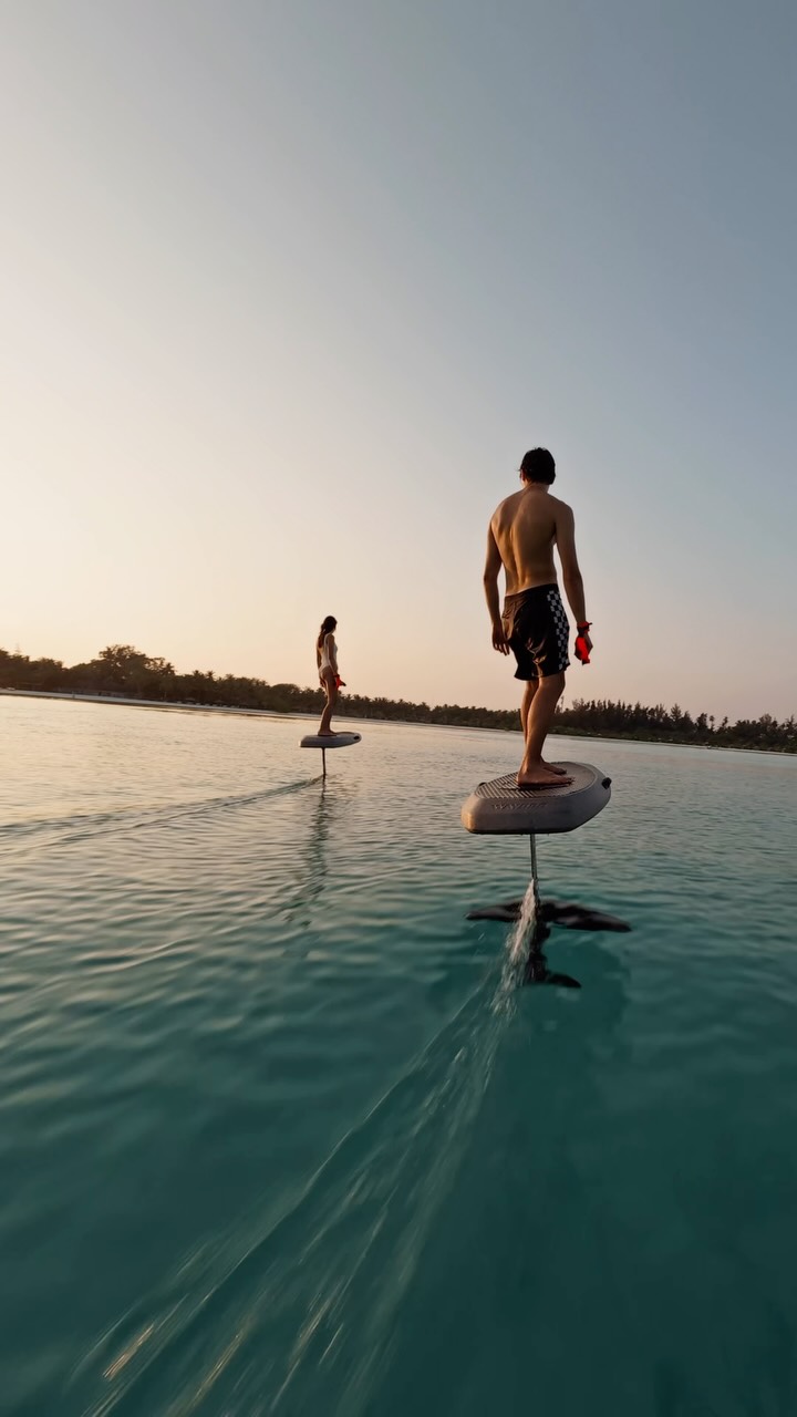 The Maldives, but from a different perspective 🌊✨ eFoiling through crystal clear waters and golden sunsets.