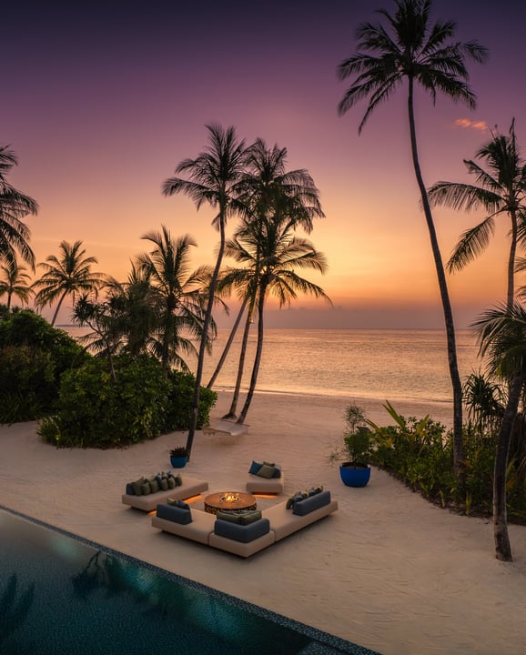 Photo by Velaa Private Island Maldives on May 24, 2026. May be an image of chaise longue, twilight, ocean, horizon, water, palm trees and text.