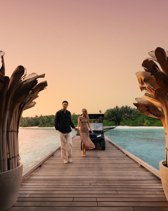 Photo shared by Velaa Private Island Maldives on June 03, 2026 tagging @aragurestaurant. May be an image of one or more people, people kissing, wedding, outdoors and text.
