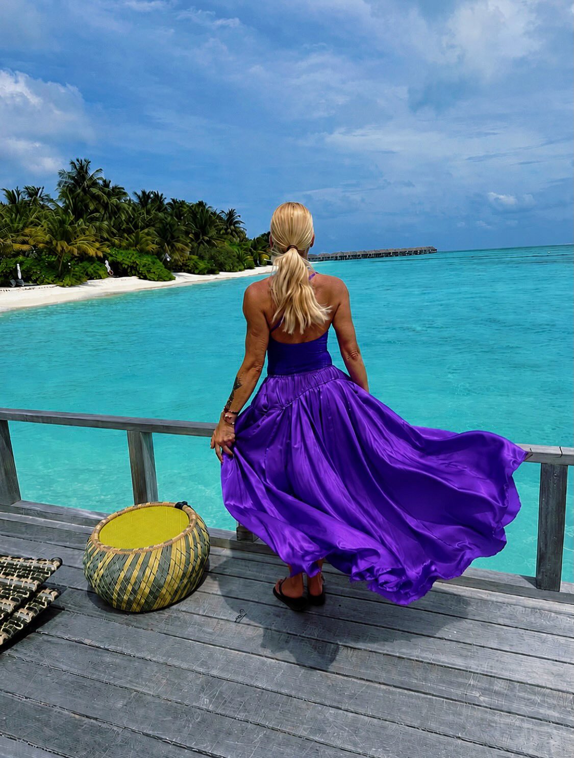 Photo shared by Cinzia Salvini 🌺 Travel Designer 🌺 on June 11, 2026 tagging @nivavelassarumaldives. May be an image of sundress, sarong, ocean and text.