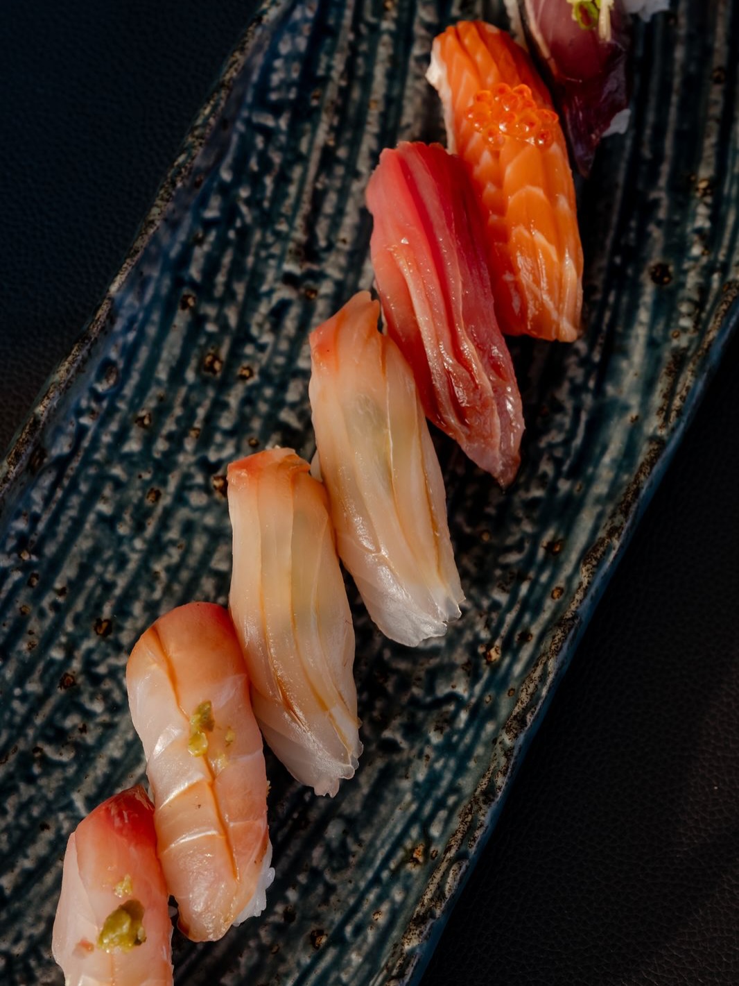 Photo by Niva Velassaru Maldives on June 18, 2026. May be an image of sashimi, sushi, salmon and text.