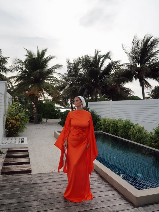 Photo shared by Hadir ElNahas on June 07, 2026 tagging @villanautica.maldives. May be an image of headscarf, dress, sarong, gown and text.