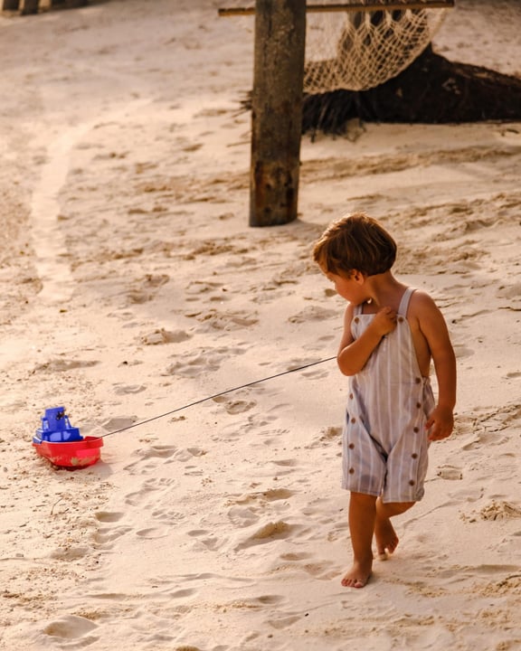 Photo shared by Villa Nautica, Maldives on June 17, 2026 tagging @visitmaldives. May be an image of baby, bucket, beach and text.