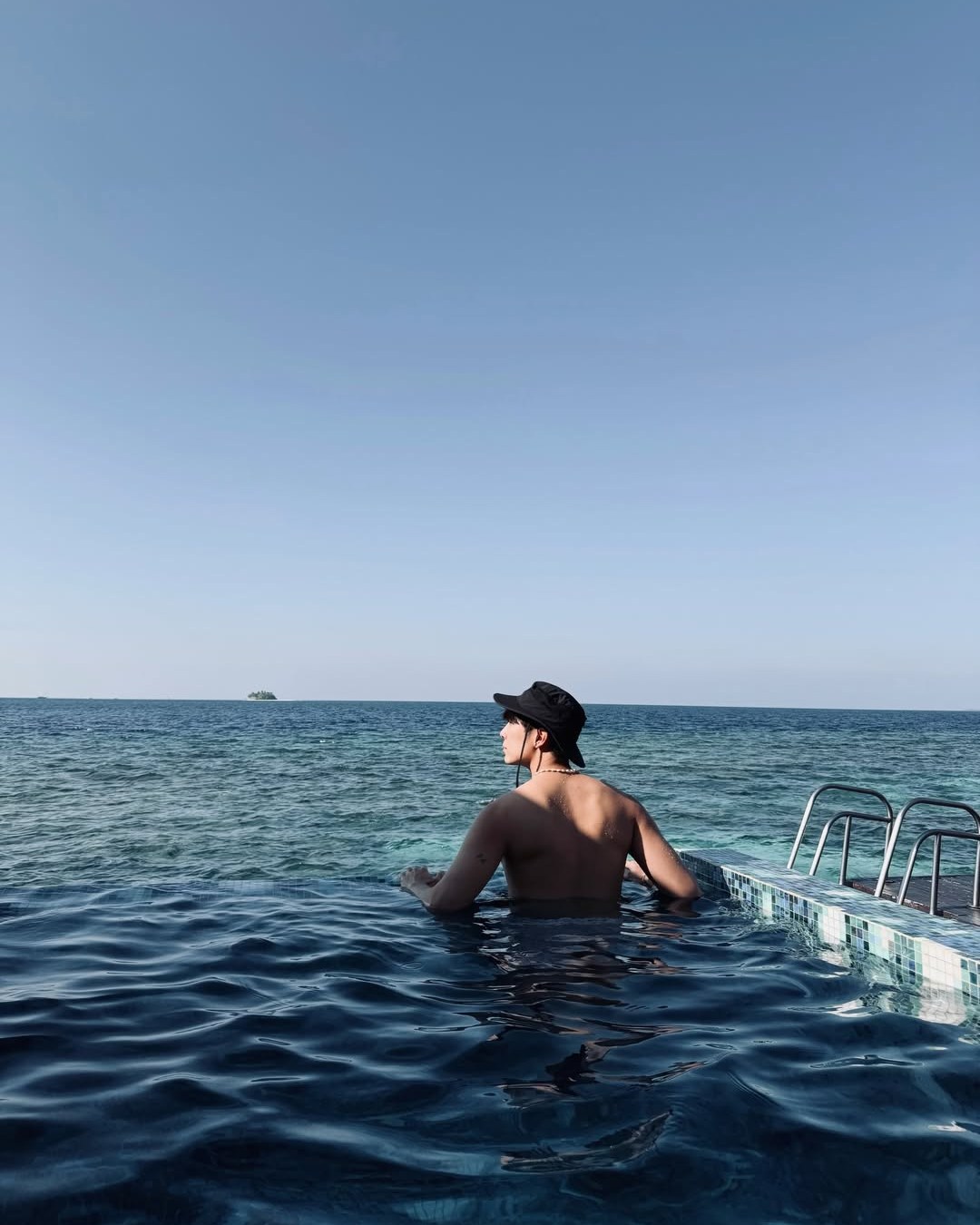 Photo by W Maldives in W Maldives with @mewsuppasit. May be an image of swimming, horizon, pool and text.
